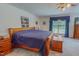 Spacious main bedroom featuring a large bed, carpeting, and natural lighting at 6305 Holly Ridge Rd, Rougemont, NC 27572