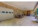 Expansive covered brick patio with seating, grill, and access to garage, perfect for gatherings at 6305 Holly Ridge Rd, Rougemont, NC 27572