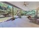 Spacious covered patio featuring outdoor seating and a grill, perfect for entertaining at 6305 Holly Ridge Rd, Rougemont, NC 27572