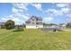 Expansive backyard featuring a pool, deck, and trampoline, perfect for outdoor activities and entertainment at 656 Atkins Rd, Fuquay Varina, NC 27526