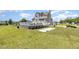 Expansive yard features an in-ground pool, patio, and home with ample space for outdoor enjoyment at 656 Atkins Rd, Fuquay Varina, NC 27526