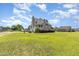 Beautiful home featuring a well-maintained lawn, pool, and basketball court in a desirable neighborhood at 656 Atkins Rd, Fuquay Varina, NC 27526