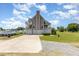 Spacious home with a multi-car garage, balconies, and well-maintained lawn offers curb appeal at 656 Atkins Rd, Fuquay Varina, NC 27526
