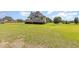 Charming home with lush front lawn and manicured shrubbery, offering a peaceful and inviting curb appeal at 656 Atkins Rd, Fuquay Varina, NC 27526