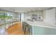 Beautiful kitchen with sage cabinets, stainless steel appliances, and a large island with barstool seating at 656 Atkins Rd, Fuquay Varina, NC 27526