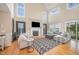 Inviting living room featuring hardwood floors, a fireplace, and a comfortable seating arrangement for relaxing at 656 Atkins Rd, Fuquay Varina, NC 27526