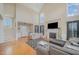 Spacious living area with high ceilings, fireplace, and lots of natural light, perfect for gathering at 656 Atkins Rd, Fuquay Varina, NC 27526