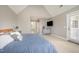 The main bedroom features lots of space with a television and bathroom access at 656 Atkins Rd, Fuquay Varina, NC 27526