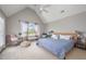 Bright main bedroom features vaulted ceilings, natural light, and neutral decor at 656 Atkins Rd, Fuquay Varina, NC 27526