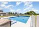 Sparkling in-ground pool with surrounding deck offers a private and serene backyard retreat at 656 Atkins Rd, Fuquay Varina, NC 27526