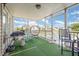 Inviting screened porch featuring comfortable seating and a view of the backyard and surrounding neighborhood at 656 Atkins Rd, Fuquay Varina, NC 27526
