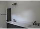 Bright bathroom featuring double vanity with white countertop and sleek black fixtures at 70 Basil Ct, Franklinton, NC 27525