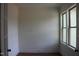 Brightly lit room with wood floors, a large window, and classic architectural details at 70 Basil Ct, Franklinton, NC 27525