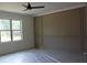 Bedroom with a neutral color scheme, large window, and molding work on the walls at 70 Basil Ct, Franklinton, NC 27525