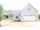 Charming home featuring a front porch, two-car garage, and attractive curb appeal at 70 Basil Ct, Franklinton, NC 27525