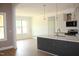 Open kitchen flows into a living space with a large window and views of the outdoors at 70 Basil Ct, Franklinton, NC 27525