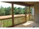 A view of a porch with railings showing trees and greenery in the background at 70 Basil Ct, Franklinton, NC 27525