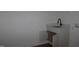 A modern sink features a black faucet and a marble countertop and an open cabinet at 70 Basil Ct, Franklinton, NC 27525