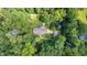 Aerial shot of a home featuring mature landscaping and a private, wooded lot at 712 Orange High School Rd, Hillsborough, NC 27278