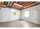 Unfinished basement with concrete floor at 712 Orange High School Rd, Hillsborough, NC 27278