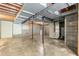 Unfinished basement with concrete floor and visible pipes at 712 Orange High School Rd, Hillsborough, NC 27278