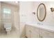 Bathroom featuring wallpaper, vanity, and toilet at 712 Orange High School Rd, Hillsborough, NC 27278