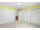 Empty bedroom with carpet and closets at 712 Orange High School Rd, Hillsborough, NC 27278