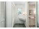 Hallway featuring a closet, vanity, and access to the bathroom at 712 Orange High School Rd, Hillsborough, NC 27278