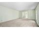 Spacious living room with neutral carpet, fresh paint and natural light at 712 Orange High School Rd, Hillsborough, NC 27278