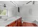 Bathroom with a double vanity, modern lighting, and a ceiling fan at 760 Stackhurst Way, Wake Forest, NC 27587