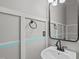 Stylish half bath features modern sink, vanity, and decorative wall paneling at 760 Stackhurst Way, Wake Forest, NC 27587