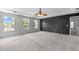Spacious bedroom featuring plush carpet flooring, ceiling fan, and plenty of natural light at 760 Stackhurst Way, Wake Forest, NC 27587