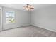 Bedroom with plush carpet, natural light, and a ceiling fan at 760 Stackhurst Way, Wake Forest, NC 27587