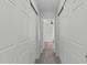 Hallway with large closets leads to a bedroom, enhancing storage and accessibility at 760 Stackhurst Way, Wake Forest, NC 27587