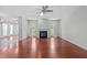 Bright living room with hardwood floors, a fireplace, and large windows for natural light at 760 Stackhurst Way, Wake Forest, NC 27587