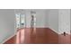 Spacious living room featuring hardwood floors and ample room for furniture arrangement at 760 Stackhurst Way, Wake Forest, NC 27587