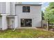 The backyard of the home featuring a sliding glass door to the patio at 7708 Falcon Rest Cir, Raleigh, NC 27615