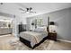 Bedroom with a ceiling fan, a decorative rug, and a nice view of the outdoors at 7708 Falcon Rest Cir, Raleigh, NC 27615