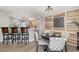 Charming dining area with decorative wood paneling and stylish seating adjacent to kitchen at 7708 Falcon Rest Cir, Raleigh, NC 27615