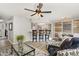 Inviting living room featuring an open concept layout connecting seamlessly to the kitchen and dining areas at 7708 Falcon Rest Cir, Raleigh, NC 27615