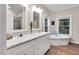 Bright bathroom with double vanity, soaking tub, and natural light at 8226 Mcarthur Park Dr, Efland, NC 27243