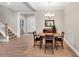 Traditional dining room with wood floors, chandelier, and view to the front entry at 8226 Mcarthur Park Dr, Efland, NC 27243