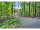 Long, secluded driveway leads to this home surrounded by a lush forest at 8226 Mcarthur Park Dr, Efland, NC 27243