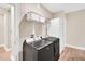 Functional laundry room with modern washer, dryer, overhead shelving, and ample storage space at 8226 Mcarthur Park Dr, Efland, NC 27243