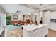 Open-concept living room with a seamless transition to the kitchen and outdoor spaces at 8226 Mcarthur Park Dr, Efland, NC 27243