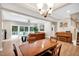 Inviting living room with an open layout, featuring a dining area and a view to an outdoor deck at 8226 Mcarthur Park Dr, Efland, NC 27243