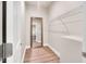 Spacious walk-in closet with built-in shelving and a full-length mirror at 8226 Mcarthur Park Dr, Efland, NC 27243