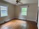 Bedroom featuring hardwood floors and lots of windows at 921 Alabama Ave, Durham, NC 27705