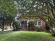 Charming single-story brick home with mature landscaping at 921 Alabama Ave, Durham, NC 27705