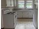 View of kitchen, including range, cabinets and appliances at 921 Alabama Ave, Durham, NC 27705